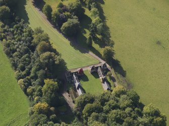 General oblique aerial view of the Downie Park House estate, centred on the stables and farmsteading taken from the NNE.