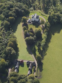 General oblique aerial view of the Downie Park House estate, centred on Downie Park House with the stables and farmsteading in the foreground, taken from the NNE.