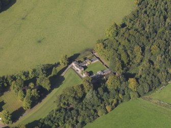 General oblique aerial view of the Downie Park House estate, centred on the stables and farmsteading taken from the SE.