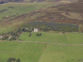 General oblique aerial view from a distance of Balintore Castle Estate, centred on Balintore Castle, taken from the SSW.