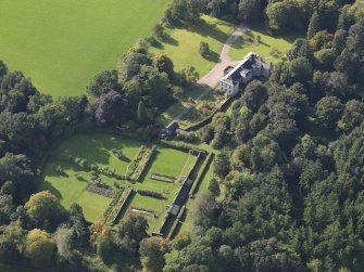 General oblique aerial view of Balnamoon House estate, centred on Balnamoon House, taken from the ENE.