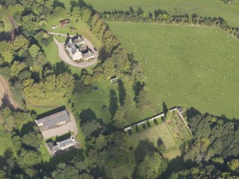 General oblique aerial view of Ardovie House estate, centred on  Ardovie House, taken from the SSW.