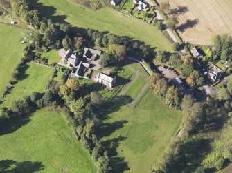 General oblique aerial view of Farnell Village, centred on Farnell Parish Chuch, taken from the SE.