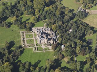 General oblique aerial view of Kinnaird Castle estate, centred on Kinnaird Castle, taken from the SE.