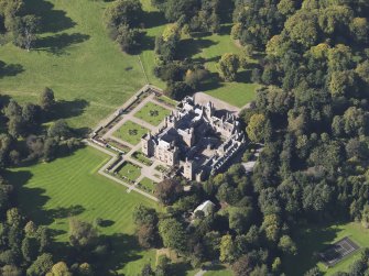General oblique aerial view of Kinnaird Castle estate, centred on Kinnaird Castle, taken from the E.