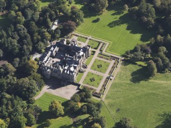 General oblique aerial view of Kinnaird Castle estate, centred on Kinnaird Castle, taken from the NW.