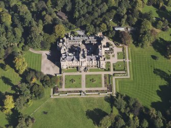General oblique aerial view of Kinnaird Castle estate, centred on Kinnaird Castle, taken from the SW.