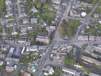 General oblique aerial view of Damacre Road, Brechin, centred the Gardner Memorial Church, taken from the SSE.