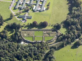 General oblique aerial view of Strathcathro House estate, centred on  Strathcathro House walled garden, taken from the NNW.