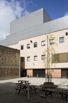 Stage door and fly tower from courtyard to south east.