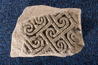 View of fragment of cross slab, Drainie no 2, with spiral decoration
