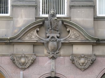 View of carved lion with shield, above entrance to 10 South St Andrew Street.