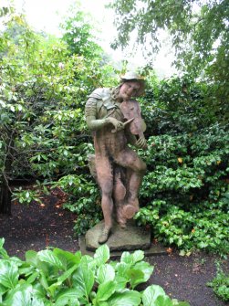 View of sculpture of a fiddler, in garden of Palace of Holyroodhouse, Edinburgh.