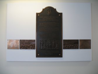 View of 'Subscribers' (The Bed Plaque Project'), along wall of N corridor on first floor.
