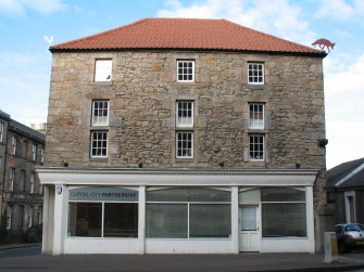 View of the Canon Mill, showing painted metal animals on roofline.