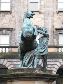 Detailed view from S of statue of 'Alexander and Bucephalus' in front of the City Chambers building, High street, Edinburgh.