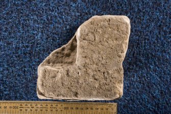 View of reverse of cross-slab fragment, Drainie no 29, displaying socket (including scale)