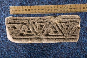 View of edge of fragment, Drainie no 22, with triangular key pattern (including scale)