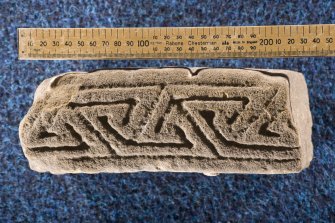 View of edge of fragment, Drainie no 22, with triangular key pattern (including scale)