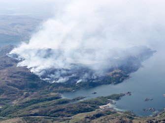 General oblique aerial view of the wild fire on the Ardnish peninsula with the railway viaduct in the foreground, taken from the NE.