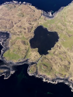 Oblique aerial view centred on Loch na h-Airde, the 'Viking Canal’ and Rubh' an Dunain, taken from the SSE.
