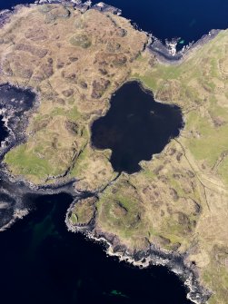 Oblique aerial view centred on Loch na h-Airde, the 'Viking Canal’ and Rubh' an Dunain, taken from the SE.