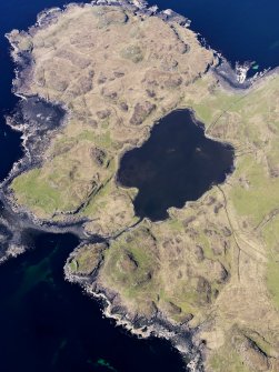 Oblique aerial view centred on Loch na h-Airde, the 'Viking Canal’ and Rubh' an Dunain, taken from the SE.