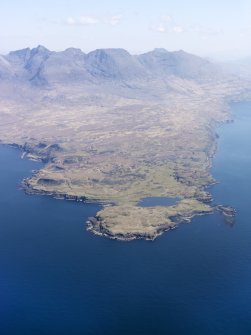 General oblique aerial view centred on Loch na h-Airde, the 'Viking Canal’ and Rubh' an Dunain with the Cuillin Hills in the background, taken from the WSW.