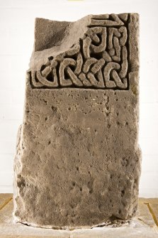 View of fragment of shrine post with carved interlace pattern