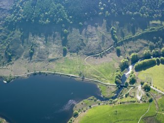 Oblique aerial view of the platforms and remains of buildings at NN 1164 1071, taken from the NW.