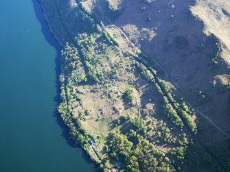 Oblique aerial view of the buildings at High Morlaggan under excavation, taken from the SW.