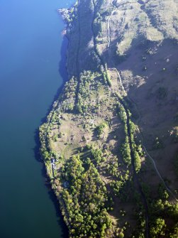Oblique aerial view of the buildings at High Morlaggan under excavation, taken from the SSW.