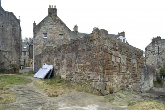 General view from NE showing the two former cottages (13 Edinburgh Road) in Sealscraig Lane with the carved grips in the outcrop to aid traffic to and from the former Landing Place.