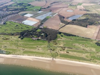 Oblique aerial view of Silverburn House & Cottages, with Leven Links (left) and Lundin Links golf course (right) to foreground, and Scoonie Municipal course (upper left), taken from the SSE.