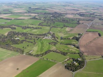 Oblique aerial view centred on Charleton Golf Course and Charleton House policies, with Balchrystie House to foreground, taken from the W.