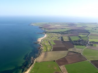 General oblique aerial view of Kingsbarns Golf Course and the village of Kingsbarns, with the Cambo Estate beyond, taken from NW.