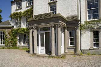 Main front, entrance porch, view from SW