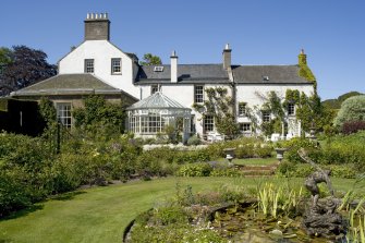 View of Pitmuies House from walled garden to S