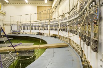 Interior. Curved wave tank building. View of modulat work platfroms, signal processing receivers (right) .