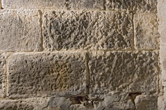 Detail of possible carved stones built into wall in basement of church