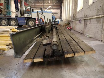 Interior. Crane 1 demolition: View of west walkway, south end showing severe shaft connecting both north and south traverser carriages