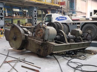 Interior. Crane 1 demolition: view of cross traveller as lifted from main crane beams. Note the wheels , these would have run along rails which are fitted to the top end of the main crane beams