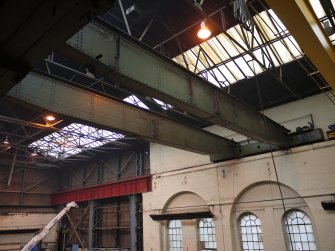 Interior. Crane 1 demolition. Main crane beams prior to demolition. Note the remains of the electrical wiring system.