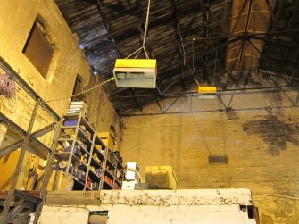 Interior. Building 1C, north wall showing blocked 9 pane wood framed windows. To the right, buts onto masonry west wall of Building 1B. Masonry remnants below windows (left) indicate an earlier structure possibly always been on site since 1870s.