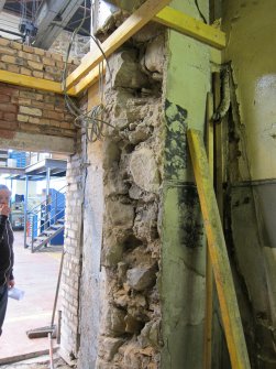 Interior. View of Building 1A1, south west end looking towards the west end of the south wall of Building 2. The original masonry stairwell wall is on the edge of shot on the right. Note the original masonry south wall of 1A1.