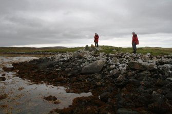 View of cairn from ENE with Mr Ian Parker and Mr Stratford Halliday, both RCAHMS.