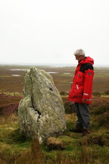 N face of standing stone with Mr Ian Parker, RCAHMS.
