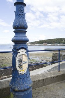 Detail of Victorian lamp standard with town coat of arms on Argyle Place, Rothesay, Bute