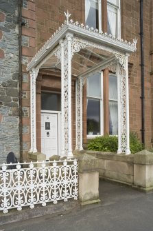Detail of decorative ironwork porch at 1-5 Marine Court, Argyle Street, Rothesay, Bute