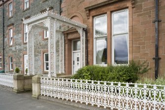 View from NNE of decorative ironwork porch and railings at 1-5 Marine Court, Argyle Street, Rothesay, Bute